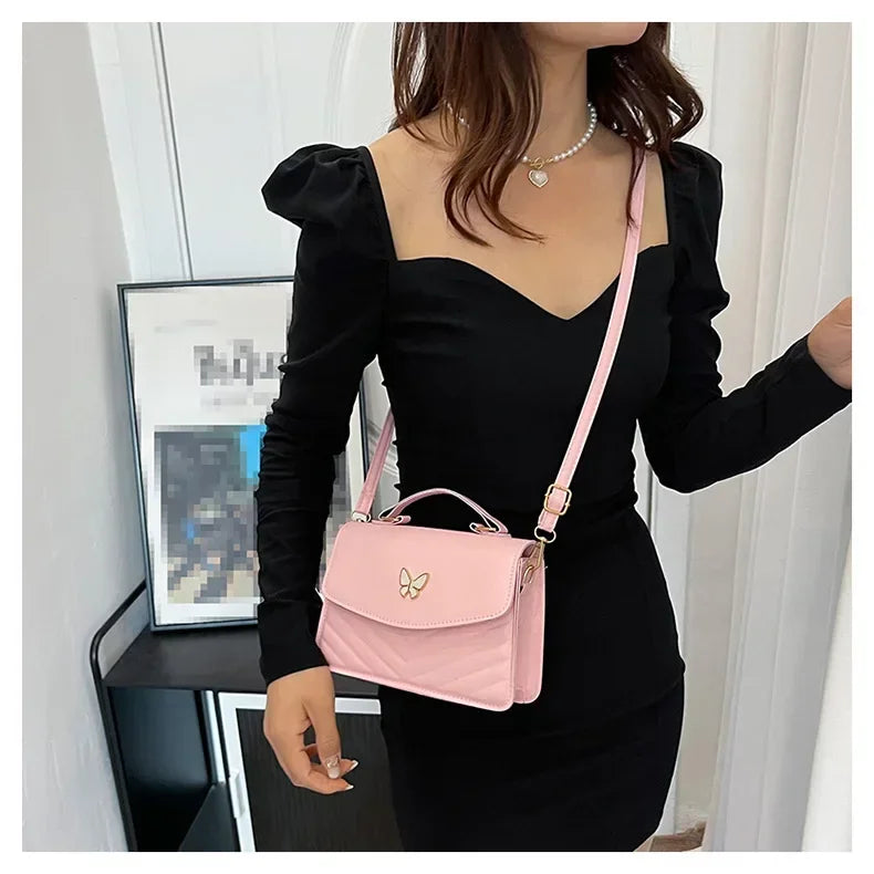 Faux leather bag with butterfly decoration