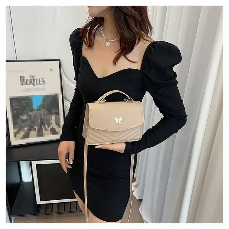 Faux leather bag with butterfly decoration