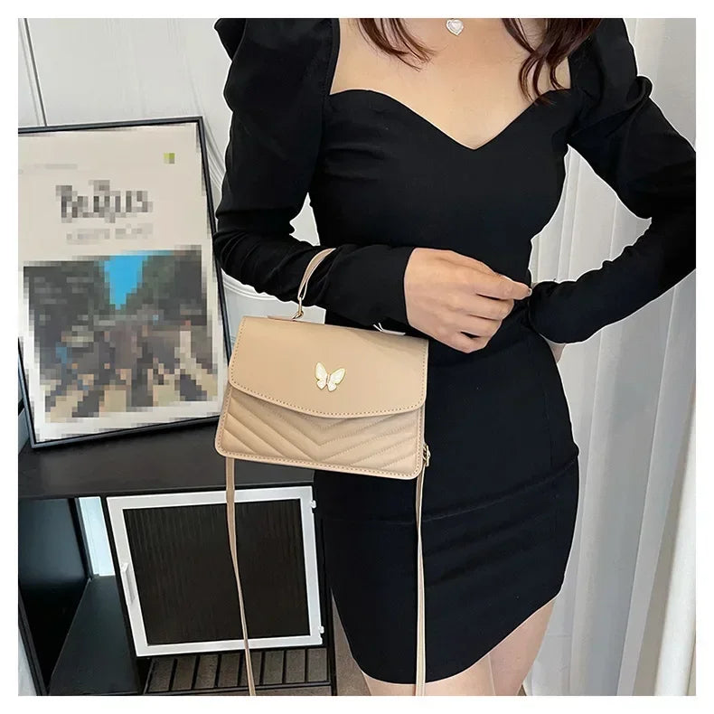 Faux leather bag with butterfly decoration