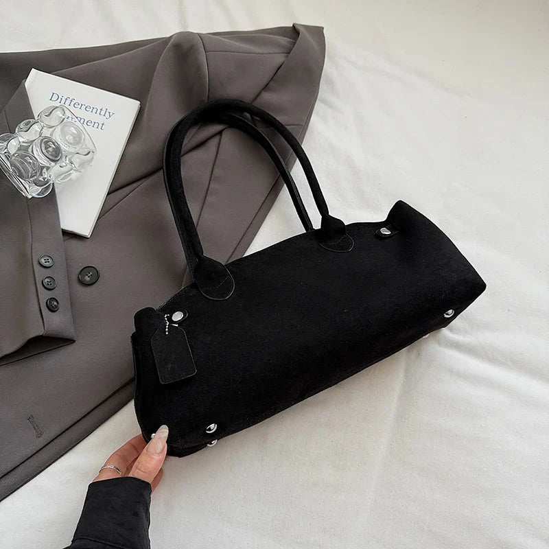 Suede bag with retro design