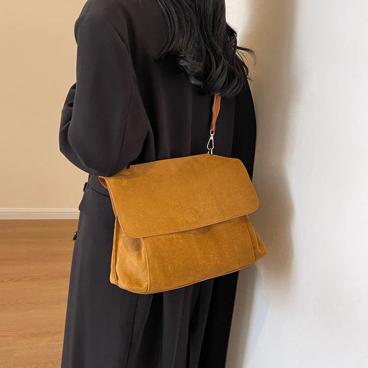 Suede bag with retro design