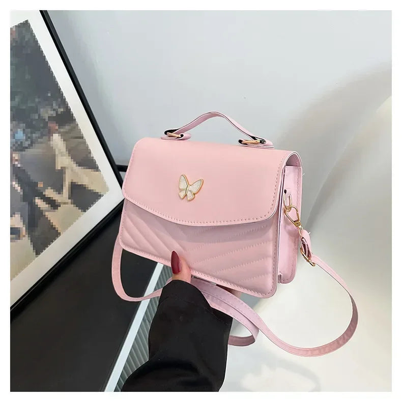 Faux leather bag with butterfly decoration