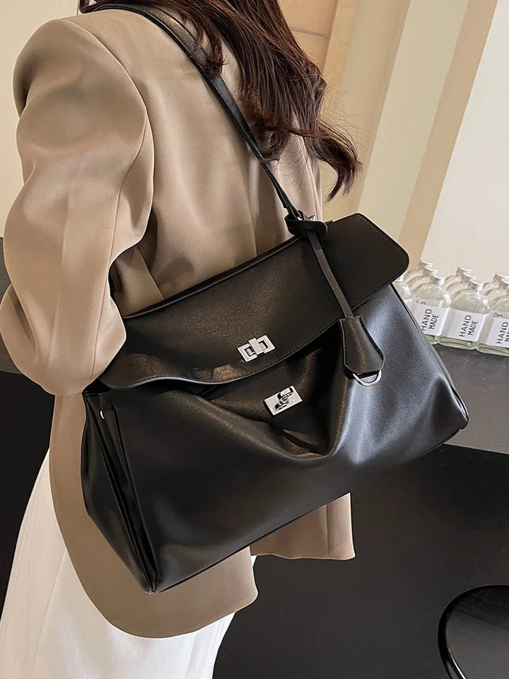 Leather bag with buckle closure