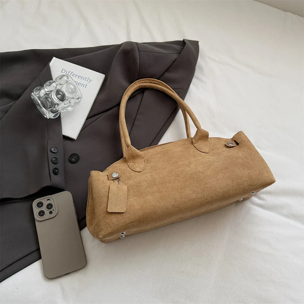 Suede bag with retro design