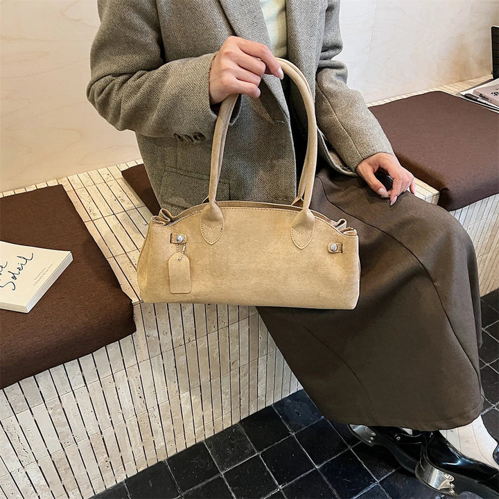Suede bag with retro design