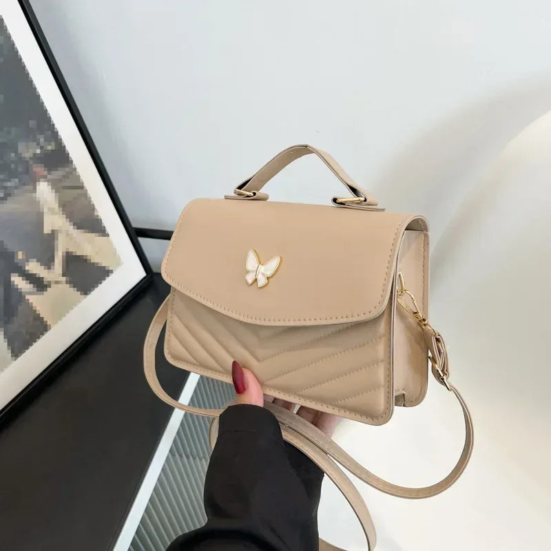 Faux leather bag with butterfly decoration