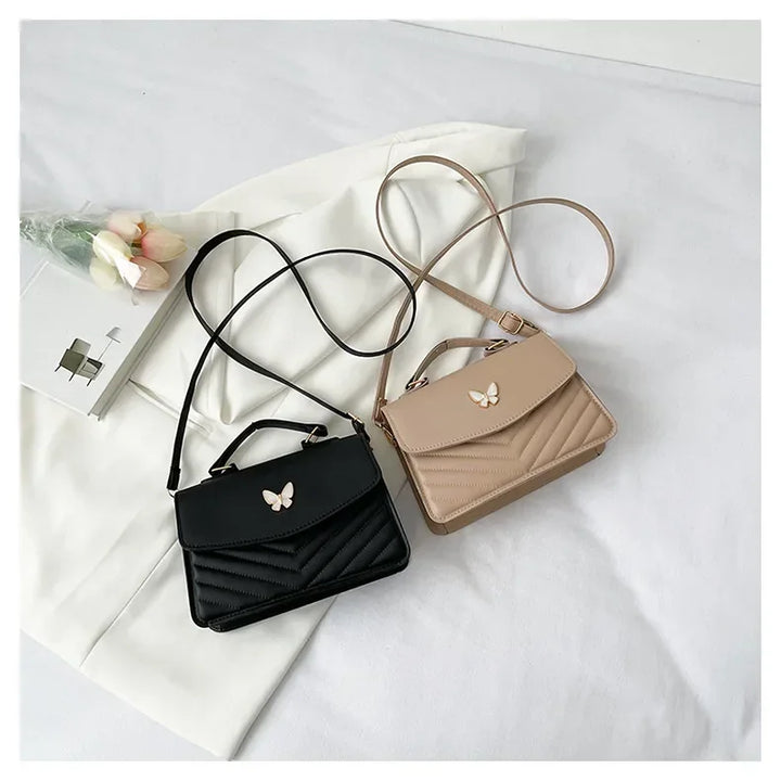 Faux leather bag with butterfly decoration