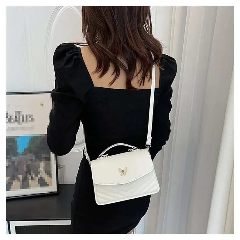 Faux leather bag with butterfly decoration