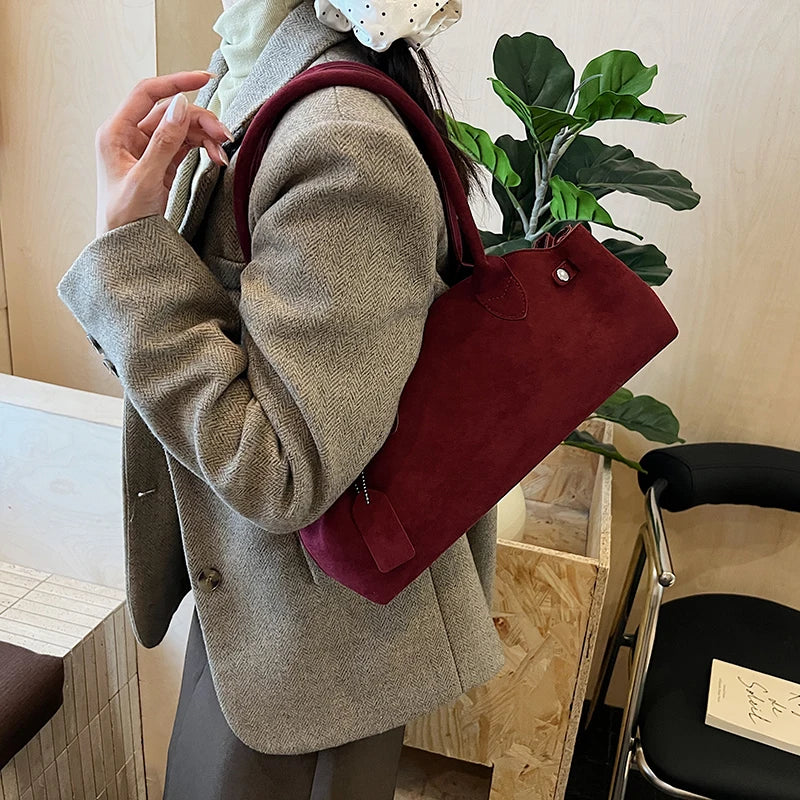 Suede bag with retro design
