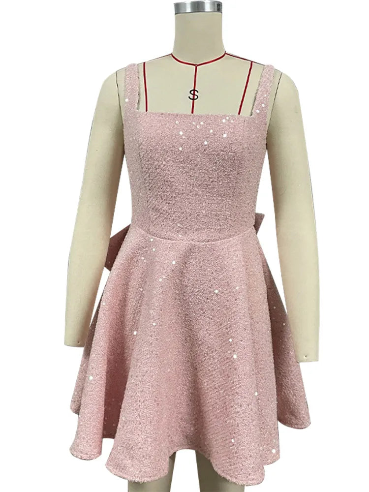 שמלת מיני פייטים בגזרת A בעיטור פפיון בגב - Alayna