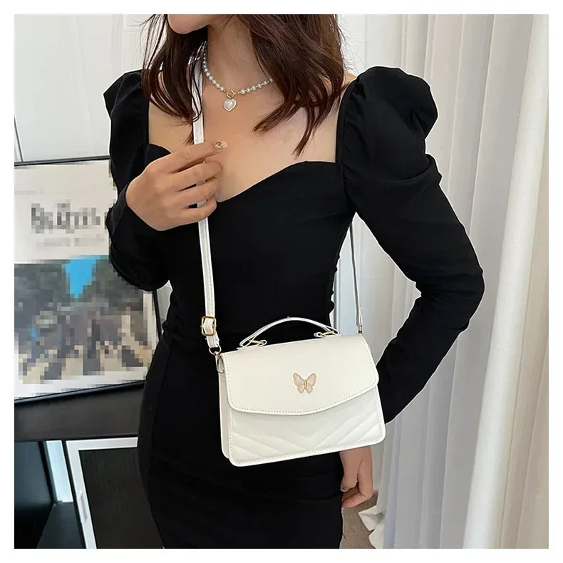 Faux leather bag with butterfly decoration