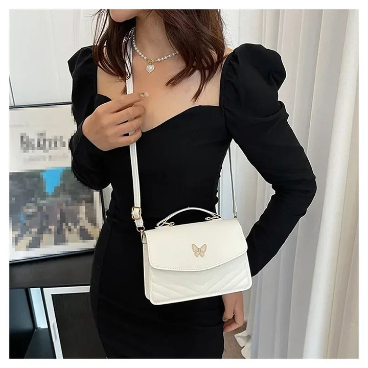 Faux leather bag with butterfly decoration